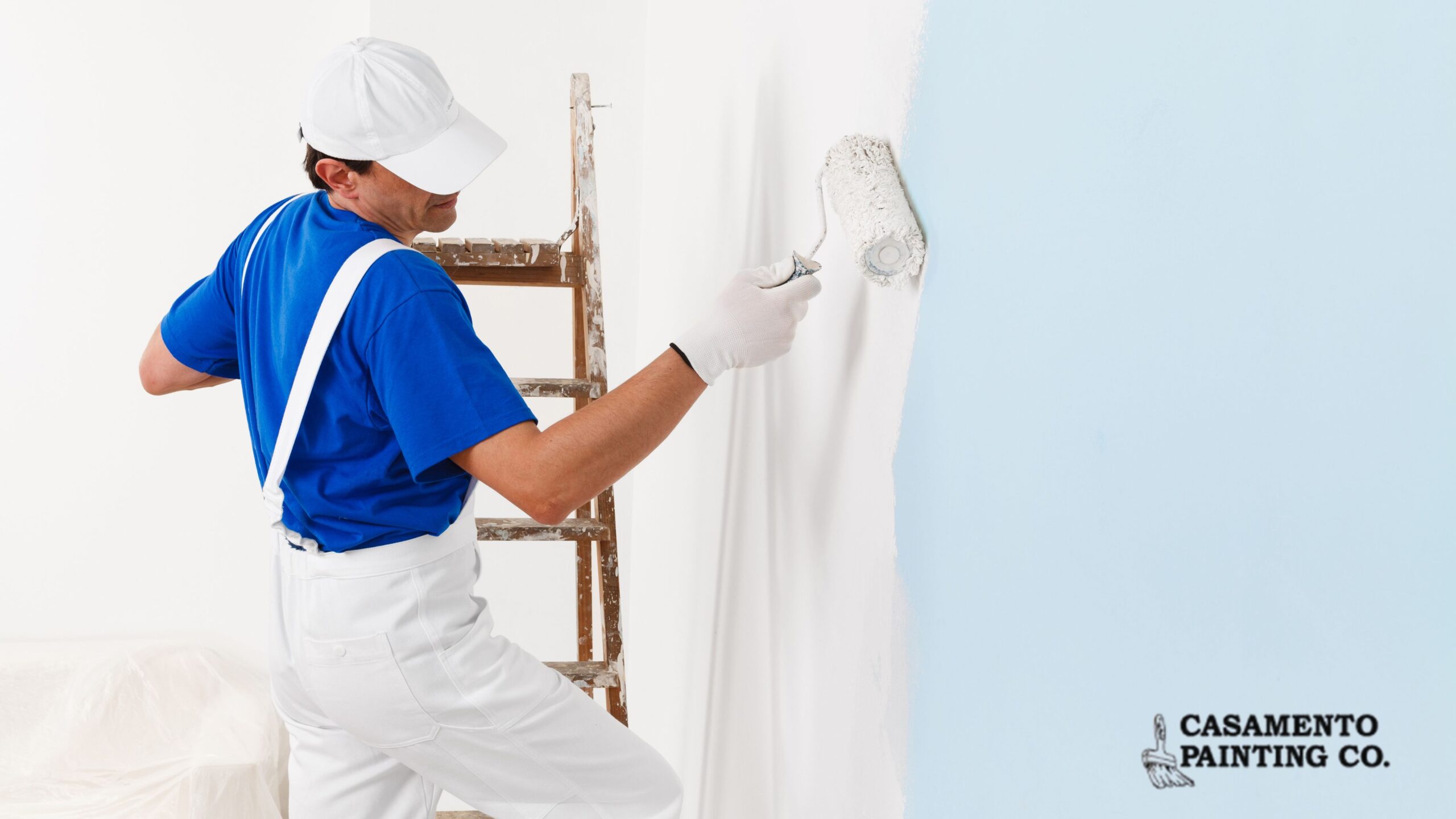 Professional residential painter applying interior wall paint in Illinois home